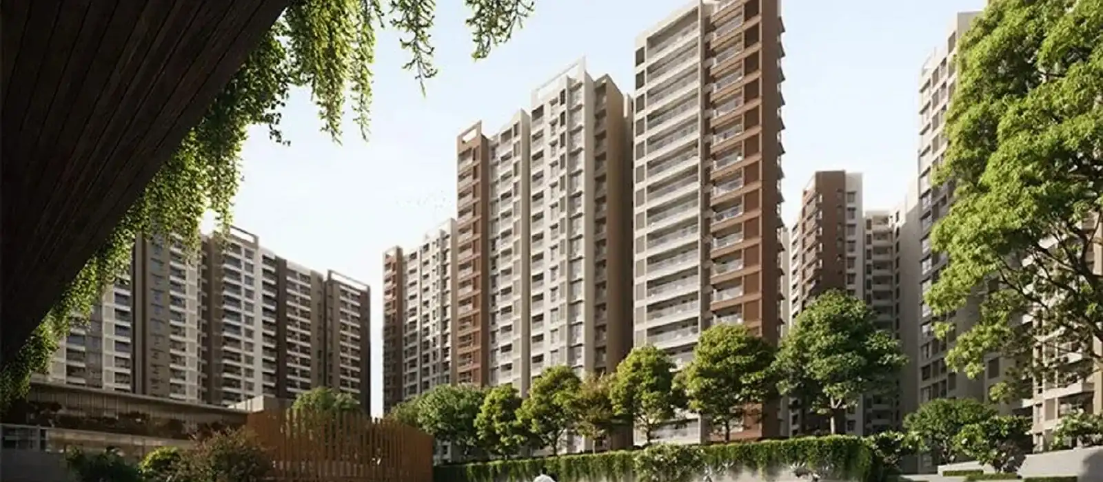 Prestige Velimela apartment blocks with tree-lined walkway